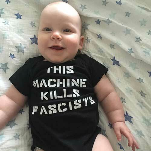 This Machine Kills Fascists Baby One Piece or Raglan Tee-